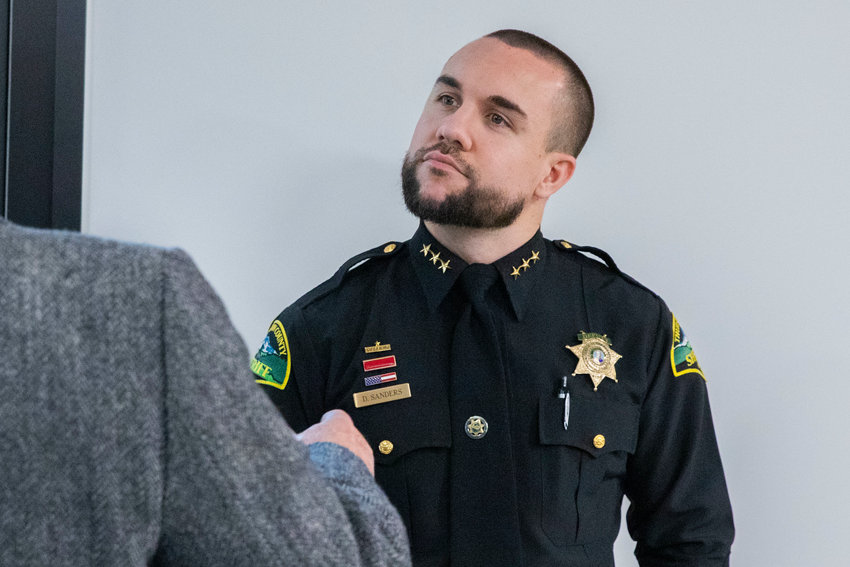Thurston County Sheriff Derek Sanders attends a meeting where Tenino residents came to speak out against a Supreme Living facility on property in Tenino last January.