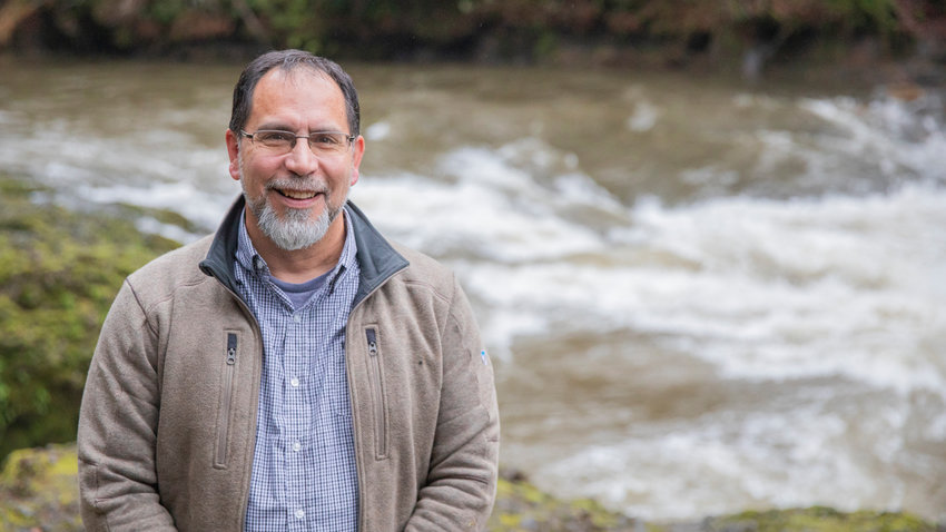Former Chehalis Tribe Chairman David Burnett smiles for a photo in front of the Chehalis River at Rainbow Falls State Park near Dryad. This location is a traditional hunting ground for lamprey by the Chehalis Tribe. The falls &mdash; which are called &ldquo;Slōsǐd,&rdquo; meaning &ldquo;fish trap,&rdquo; in the oral history &ldquo;Honn&eacute;, the Spirit of the Chehalis&rdquo; &mdash; are within the ceded territory of the Confederated Tribes of the Chehalis Reservation. In the 1960s, the U.S. settled a lawsuit with the Tribe for 3 million acres of land, including these ancient hunting grounds. The federal government paid just $1.7 million for the land &mdash; about 50 cents an acre. The falls are still within the Tribe&rsquo;s usual and accustomed hunting and fishing grounds, and lamprey are caught there every year.