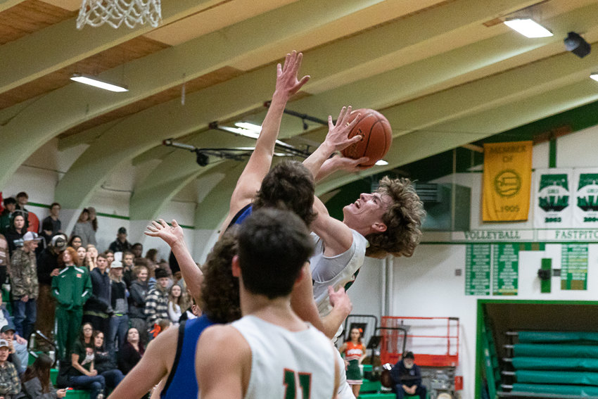 Morton-White Pass guard Judah Kelly rises for a basket while being fouled Jan. 20 against Toutle Lake.