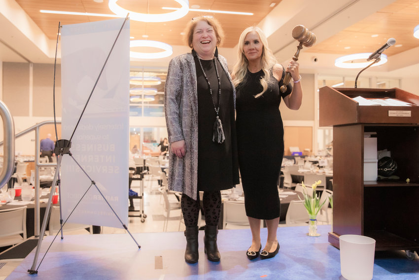 Cynthia Mudge and Coralee Taylor pose for a photo after the passing of the gavel following the Centralia-Chehalis Chamber of Commerce banquet in January 2023.