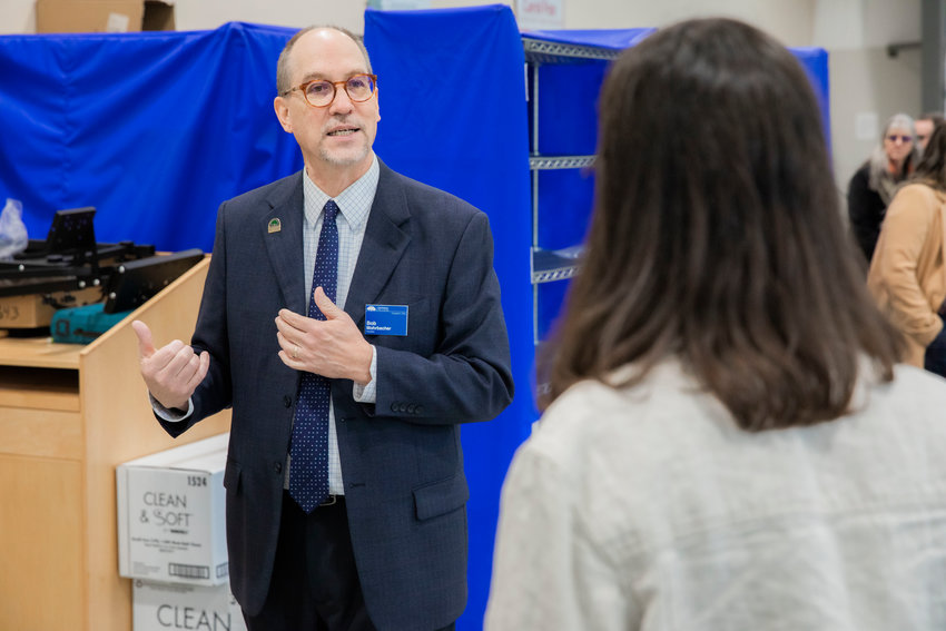 Centralia College President Bob Mohrbacher talks about bachelor programs available for students while taking U.S. Rep. Marie Gluesenkamp Perez on a tour of the campus in January 2023.