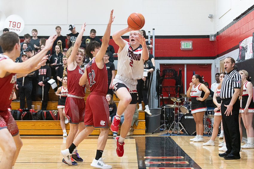 Tenino's Austin Gonia tries tto save the ball from going out of bounds during the second half of the Beavers' 47-33 loss to Hoquiam on Jan. 24.