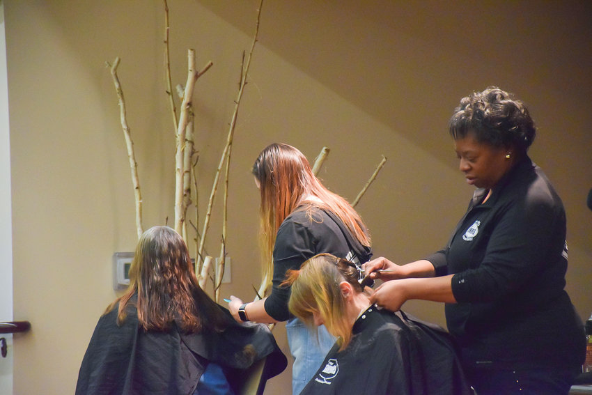 Volunteers provide haircuts during Project Homeless Connect at St. Joseph Catholic Church in Vancouver on Thursday, Jan. 26.