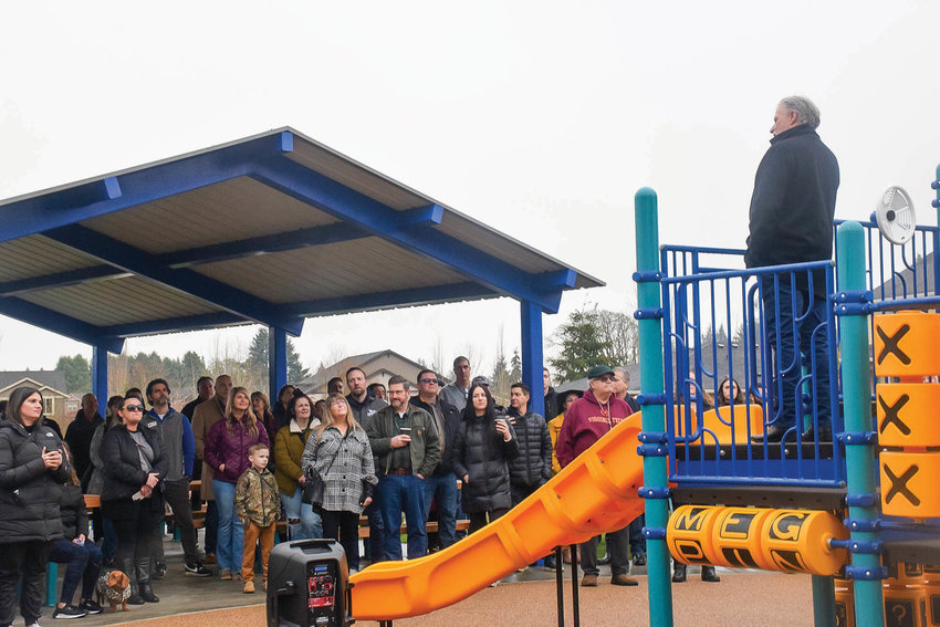 Hinton Development Partner Mark Hinton speaks to a crowd gathered for the opening of DeMelo Park in Ridgefield on Jan. 28.