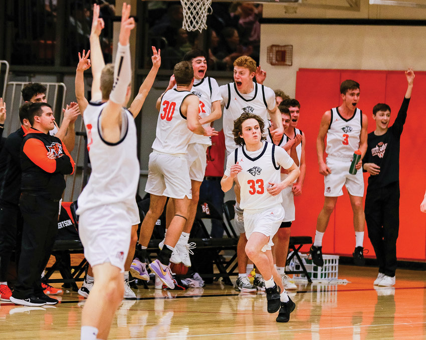 Battle Ground&rsquo;s Luke Kostman (33) heads up the floor after   drilling a corner three late in the fourth quarter of the game against Prairie High School on Friday, Jan. 27.