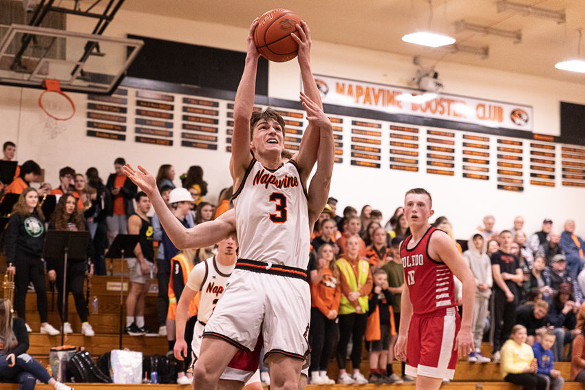Napavine guard James Grose fights through contact for a layup against Toledo Jan. 31.