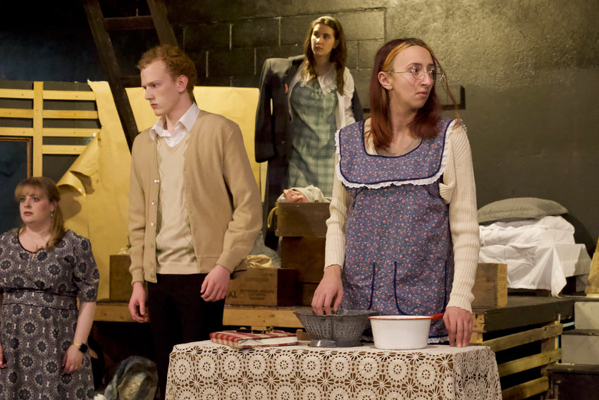 Residents of the Secret Annex react to a siren during a rehearsal of &ldquo;The Diary of Anne Frank&rdquo; at the Evergreen Playhouse in Centralia last week. From left is Emilie Brown as Mrs. Van Dann, Nathan Crummett as Peter Van Daan, Ruby Stanton as Anne Frank and Lizzie Conner as Margot Frank.