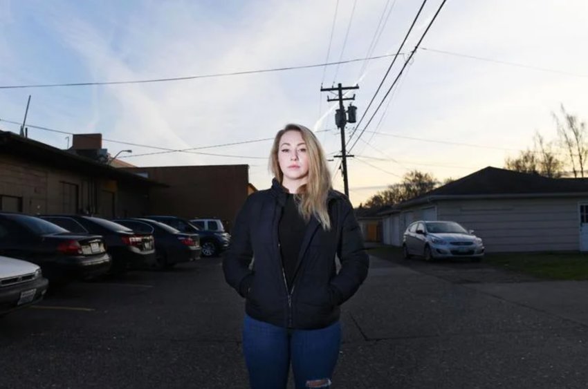 Amanda Albright poses for a portrait on Wednesday, Feb. 1, in the alley behind Shamrock Tavern in Longview. Jonathan Solomon Friend is accused of breaking her orbital bone after assaulting her on Jan. 16 near the location.&nbsp;