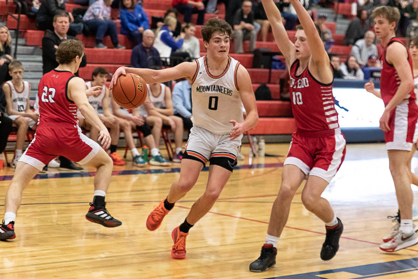 Rainier forward Hunter Howell drives for a baseline reverse against Toledo in the consolation round of the 2B District 4 tournament at Black Hills Feb. 10.