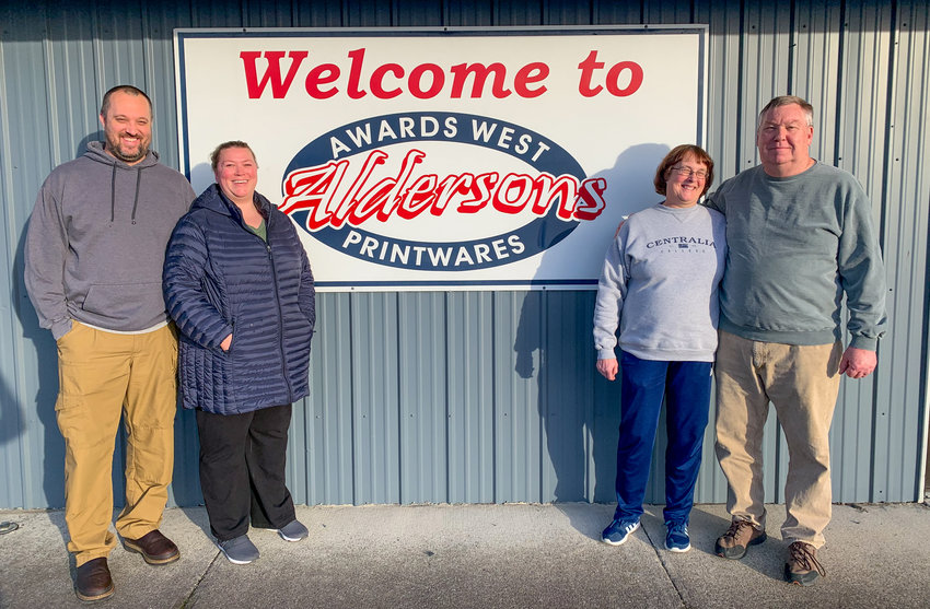 Tom and Karen Alderson, right, pose in front of their business with their son and daughter-in-law, Alex and Ellisa Alderson. The business just celebrated its 50th anniversary. Tom and Karen Alderson have now worked there for 37 years and have been the sole owners since 1994.