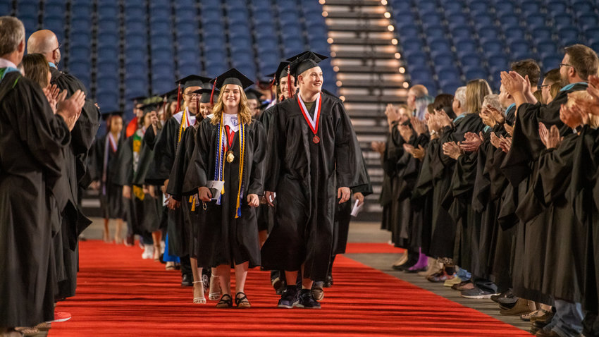 Students walk through the Tacoma Dome during their graduation ceremony on June 16, 2022. Yelm Dollars for Scholars will host its 28th annual live auction and dinner from 5 to 9 p.m. on Saturday, March 11, at the Lake Lawrence Community Club in Yelm. The auction helps raise money for Yelm High School graduates pursuing further education and training in the form of scholarships.