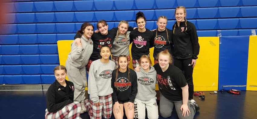 The Yelm girls wrestling team poses for a photo at the regional tournament on Saturday, Feb. 11.