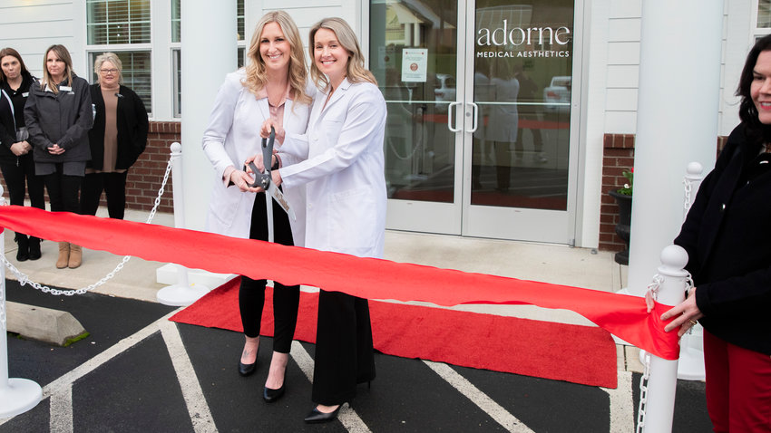 Adorne Medical Aesthetics owners Krystal Mishler, left, and Laura Stajduhar smile for a photo during a ribbon-cutting ceremony hosted by the Centralia-Chehalis Chamber of Commerce in Chehalis on Tuesday. The business is located at 2530 NE Kresky Ave., Suite C, in Chehalis. Mishler and Stajduhar opened Adorne Medical Aesthetics last year on May 18. As part of its recent expansion, Adorne Medical Aesthetics is adding a new aesthetician to its staff and a second location at the Chehalis Thorbeckes providing massage therapy. The announcement for the ribbon-cutting stated Mishler and Stajduhar&rsquo;s &ldquo;holistic and personalized approach goes beyond injectables and laser treatments. Their focus is on the overall wellness of their clients and increasing personal confidence in their own skin.&rdquo; For more information, visit their website at adorne.org or follow their Instagram account at @adorne_medical_aesthetics or their Facebook page @adornemedical.