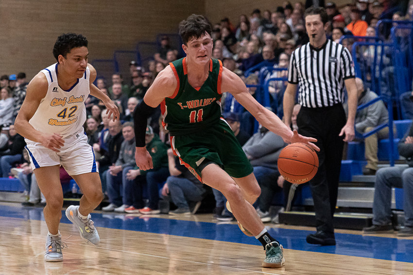 Morton-White Pass forward Hunter Hazen drives baseline against Chief Leschi in the 2B District 4 semifinals at Kelso Feb. 15.