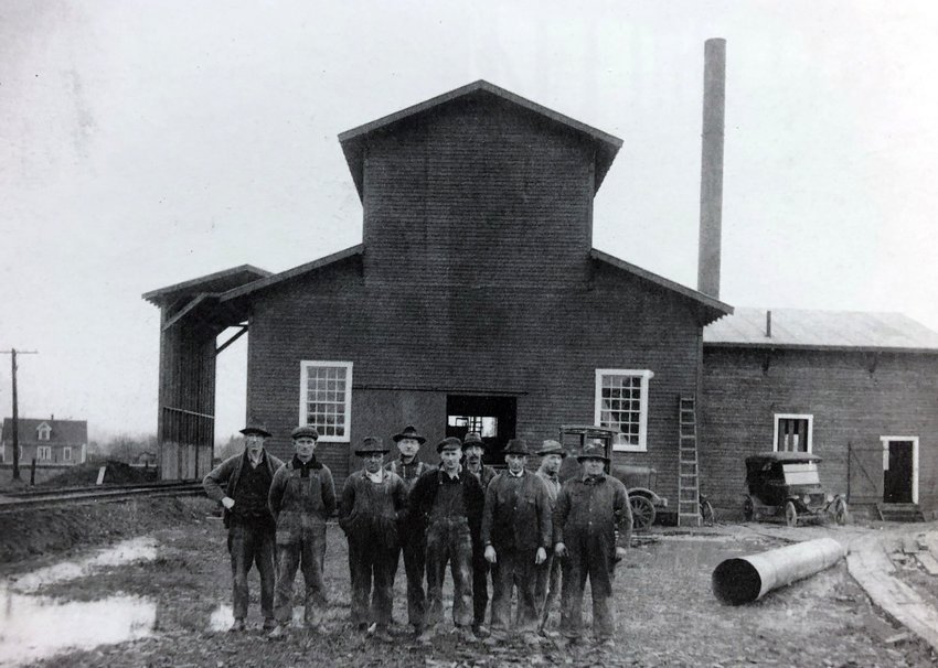 HISTORY PHOTO OF THE WEEK: This 1920 photo is of a Centralia plant that manufactured briquettes from coal dust using a petroleum-based binder. It was located in the vicinity of what is now the 1100 block of J and K streets in Centralia. The plant was in operation during the early 1920s and was run by a man known as &quot;King&quot; Kenny and his brother. The third man from the left in this photo is Sutton Nunn. Nunn was born in England in the town of Sutton and worked at the time at the plant. He came to Centralia by way of Canada and married Elsie Wright Nunn. The couple had three children they raised in Centralia. Nunn descendants remain in the area. This photo and information was originally submitted by Jim Nunn, grandson of Sutton Nunn, for The Chronicle&rsquo;s Our Hometowns books.
