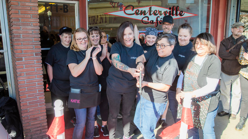 Lisa and Michelle Little smile as a ribbon is cut outside The Centerville Cafe in Centralia on Wednesday during an event hosted by the Centralia-Chehalis Chamber of Commerce. The Centerville Cafe reopened Jan. 5 with new owners Michelle and Lisa Little in downtown Centralia. The cafe is located at 111 N. Tower Ave. in Centralia. Both Michelle and Lisa Little grew up in the area and have been going to The Centerville Cafe for over 20 years. Before being approached by the previous owners, Marion Manzer and Morris Gall, about purchasing the restaurant, Michelle Little managed a restaurant in Olympia, and Lisa Little worked as a nurse. Manzer and Gall wanted the restaurant to stay family owned to maintain the spirit of The Centerville Cafe in Centralia. According to the chamber, the cafe got its name in 2013 when Manzer and Gall bought what had been called the &ldquo;Jersey Diner&rdquo; and renamed it after the original name of Centralia, which was Centerville. The Centerville Cafe &mdash; under various names &mdash; is more than 120 years old.  &ldquo;We focus on having really good food, cooked with love. We want it to feel like home when you come in. Our staff really makes this place amazing,&rdquo; Michelle Little said.