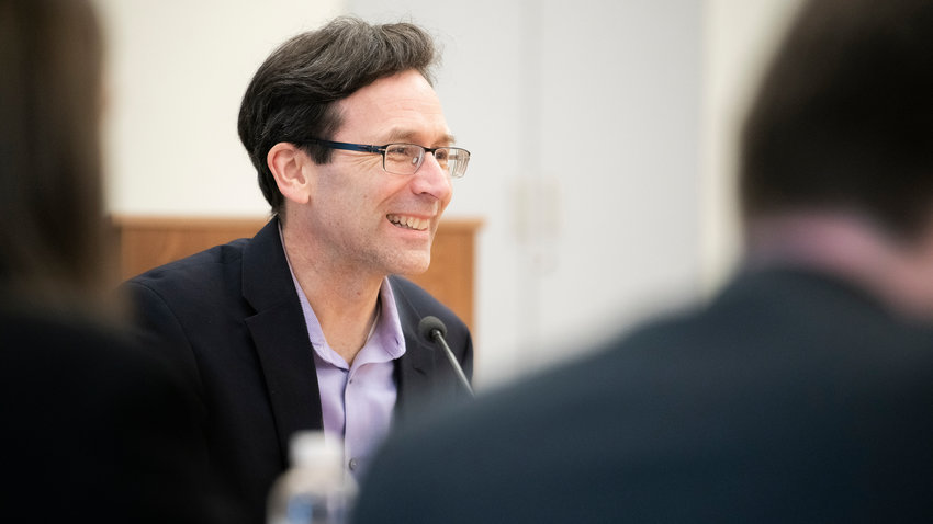 Attorney General Bob Ferguson smiles while talking with members of the press during a legislative meeting inside the John A. Cherberg Building in Olympia last week.