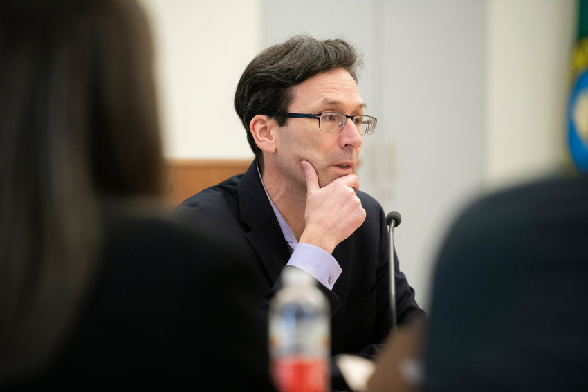 Attorney General Bob Ferguson talks to members of the press during a legislative meeting inside the John A. Cherberg building in Olympia in February 2023.