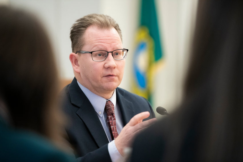 Superintendent of Public Instruction Chris Reykdal talks about Centralia High School during a legislative meeting inside the John A. Cherberg building in Olympia in February 2023.