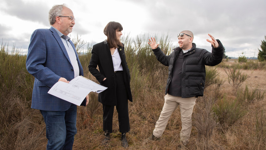 Congresswoman Marie Gluesenkamp Perez smiles while touring the proposed site of the Southwest Washington Agricultural &amp; Innovation Park in Tenino with Mayor Wayne Fournier and Perry Shea, with Dragonwheel Investment Group Inc.