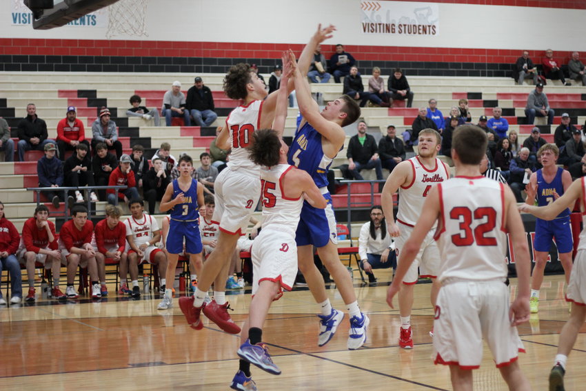 Asher Guerrero draws contact in the lane during Adna's 75-60 loss to Davenport in the opening round of the 2B state tournament on Feb. 24 in Cheney.