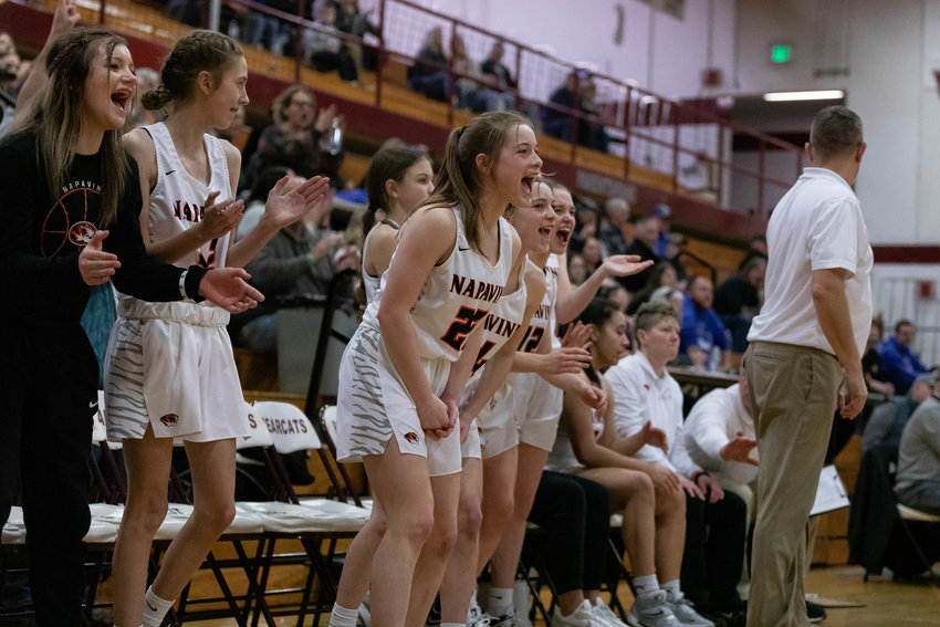 The Napavine bench celebrates after a big play in its 52-44 win over La Conner at W.F. West Feb. 24 in the opening round of the 2B State Tournament.