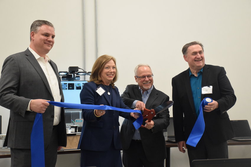 From left, IT3 Innovation Center Board of Directors Vice-Chair Brian Taylor, Siemens U.S. CEO Barbar Humpton, IT3 CEO Kevin Witte and IT3 board chair Ron Arp cut the ribbon during a ceremony that celebrated the opening of the Innovation Center&rsquo;s Ridgefield facility on Feb. 22.