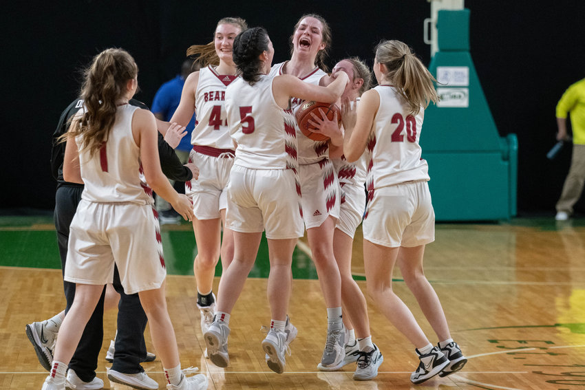 Amanda Bennett and the W.F. West girls basketball team celebrate their 57-48 win over Renton in the Round of 12 of the 2A girls basketball state tournament, March 1 in Yakima.