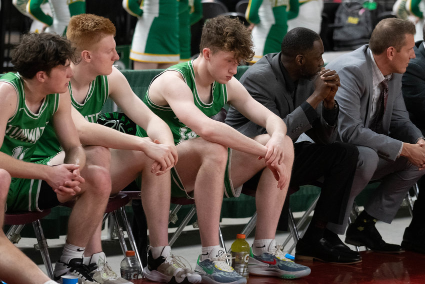 The Tumwater bench sits despondent during the final seconds of the T-Birds' 60-51 loss to Mark Morris in the quarterfinals of the 2A state tournament, March 2 in Yakima.