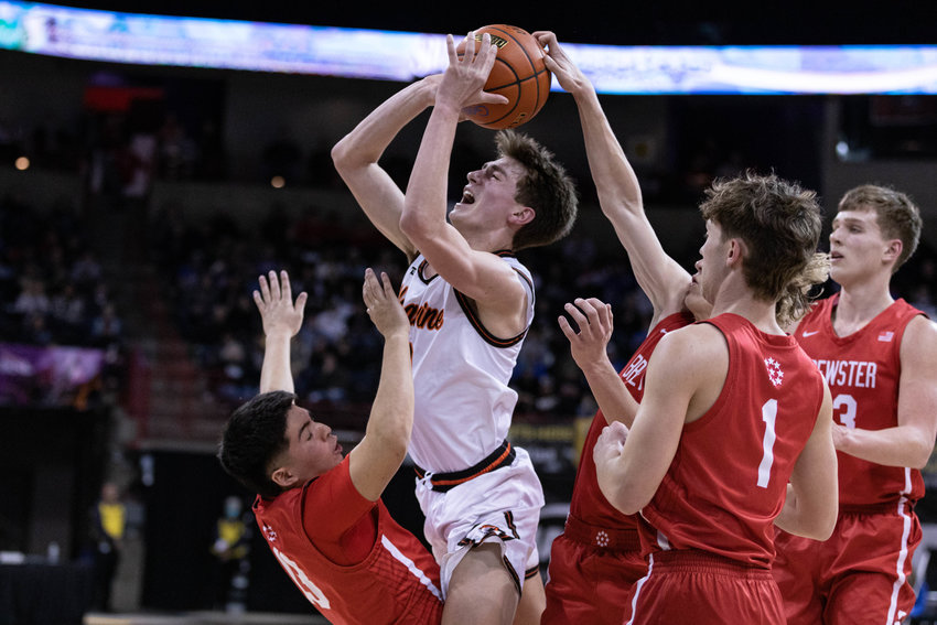 Napavine guard James Grose draws a block foul against Brewster in the 2B state quarterfinals at Spokane Arena March 2.