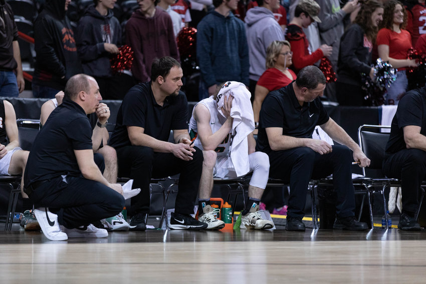 Morton-White Pass guard Judah Kelly covers his head with a towel after a 51-44 defeat to Lind-Ritzville/Sprague/Washtucna in the 2B state quarterfinals at Spokane Arena March 2.