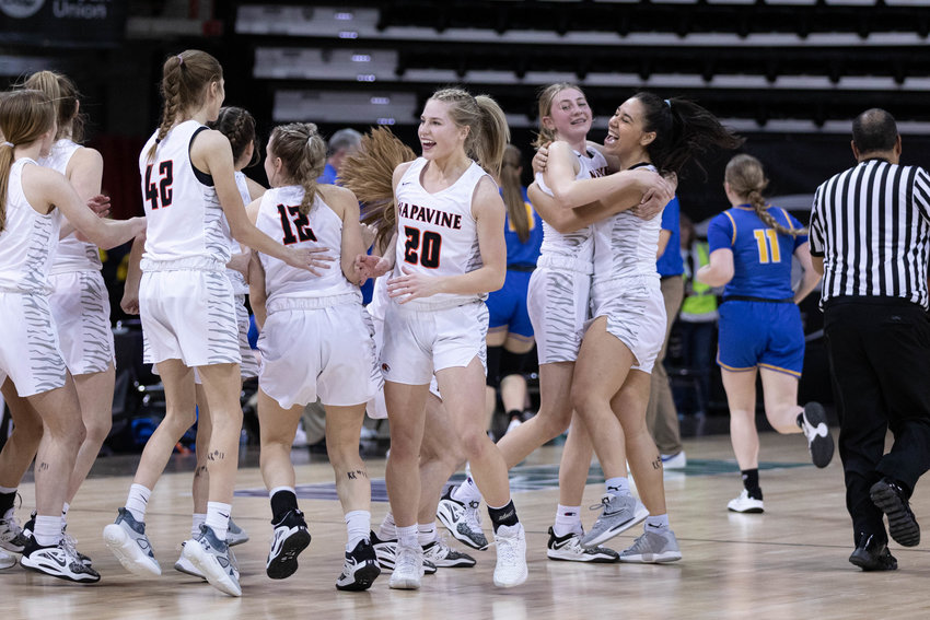 The Napavine girls basketball team celebrates after defeating Adna in the 2B state quarterfinals at Spokane Arena March 2.