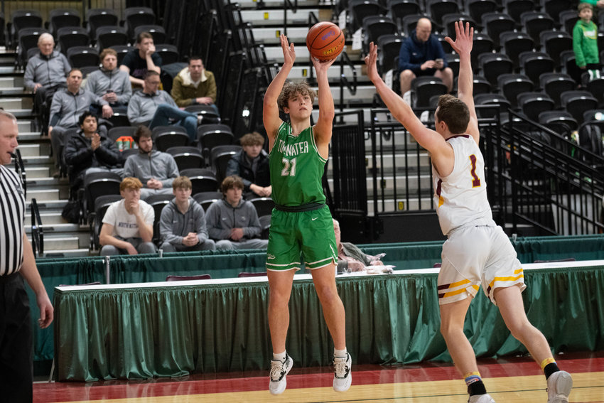 Connor Hopkins shoots a 3-pointer during the first half of Tumwater's loser-out game against Enumclaw on March 3 in Yakima.