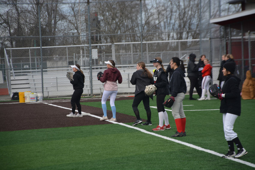 Members of the Yelm fastpitch team participate in throwing drills prior to practice on Monday, March 6. Their first game is on Saturday, March 18 at Auburn Riverside High School. They will play two separate games against Adna and Skyline.