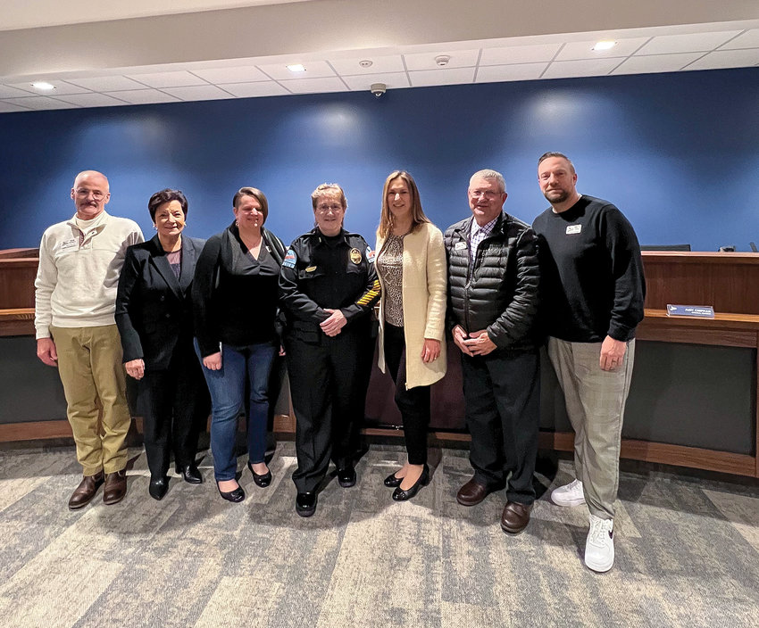 Ridgefield City Council members stand next to the city&rsquo;s newly sworn-in city Police Chief Cathy Doriot in the city council chambers on March 9.