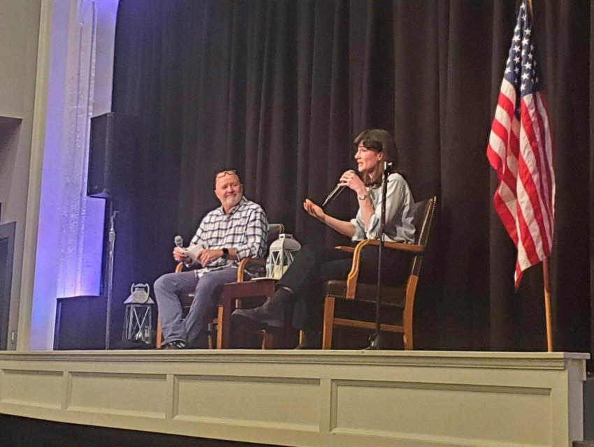 Rep. Marie Gluesenkamp Perez, right, speaks during a town hall at the Roxy Theater in Longview on March 13, 2023. CEDC President Ted Sprague moderated the session.
