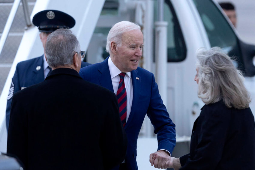President Joe Biden greets Rep. Dina Titus (D-NV), right, as he arrives at Harry Reid International Airport on March 14, 2023, in Las Vegas. (Ellen Schmidt/Las Vegas Review-Journal/TNS)