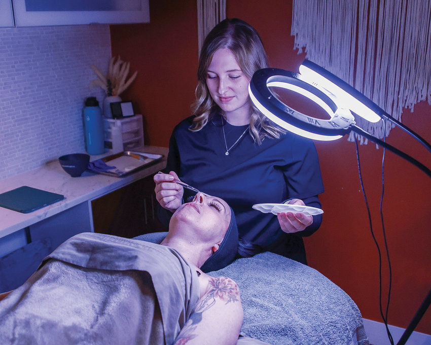 Ashley Venneri, who owns Face Forward Esthetics,  prepares a patient for a skin care treatment on Wednesday, March 15.
