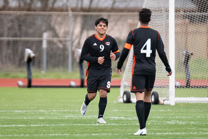 Centralia forward Leo Perez smiles after his second goal against Tenino at Tiger Stadium March 25.