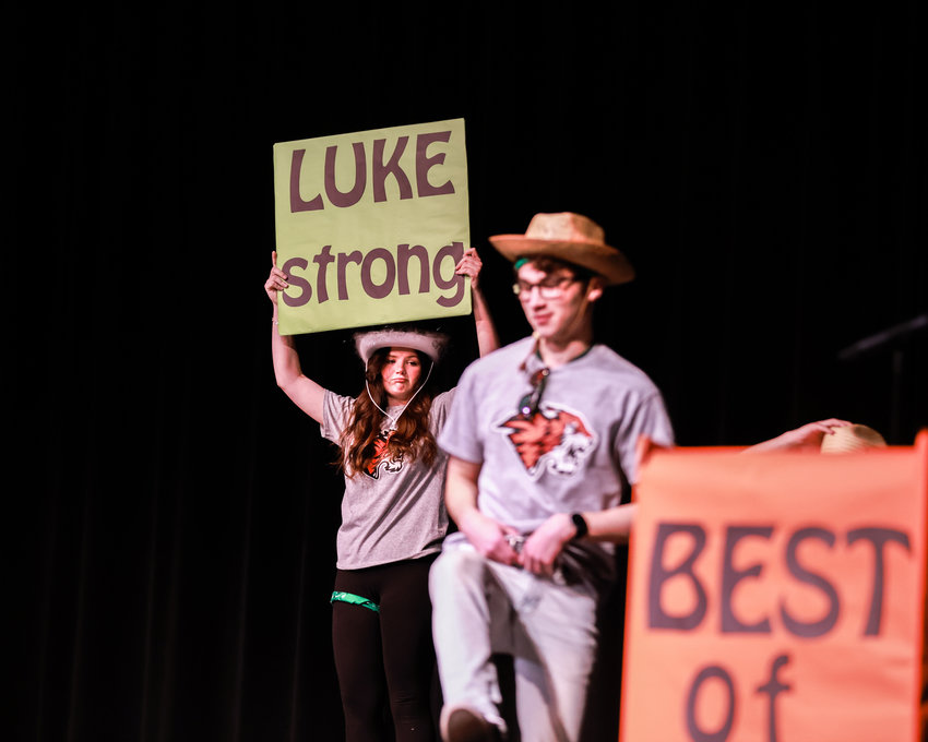 Morgan Nixon holds a &quot;Luke Strong&quot; sign during the opening dance of the Best of BG competition on Saturday, March 25 at Battle Ground High School.  The event raised money for Luke Montei, a teen who received a heart transplant the following day.