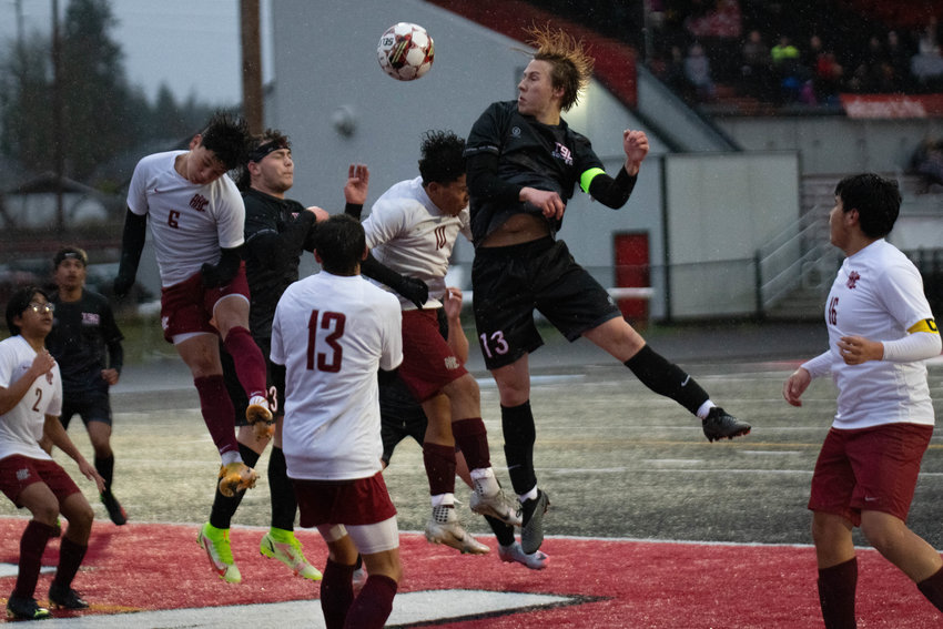 Alex Reichelderfer goes up for a header during the second half of Tenino's 1-0 loss to Hoquiam on March 31.