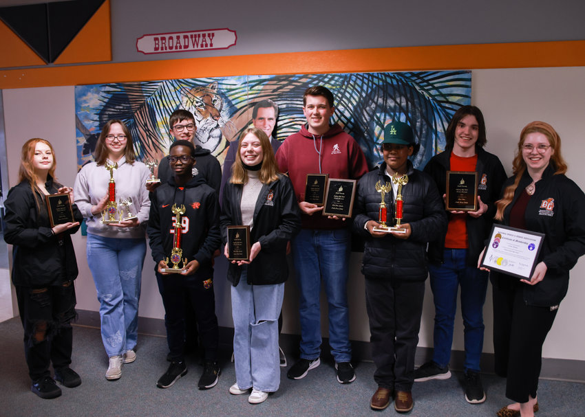 Battle Ground High School&rsquo;s speech and debate team won many accolades in its first year back since the pandemic. Posing with their awards are Jacob Richins, Clarity Cook, Marley Wing, Brendan Doughty, Elizabeth McAleer, Mackenzie Heffner, Romario Fajardo-Zuniga, Reginald Noble-Weah and adviser Corinne Altotsky