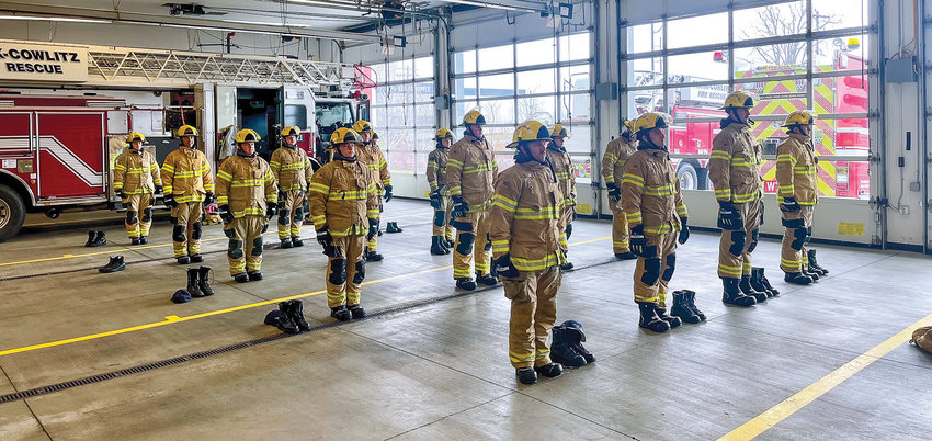 Firefighters and firefighter paramedics take part in day one of recruit academy.
