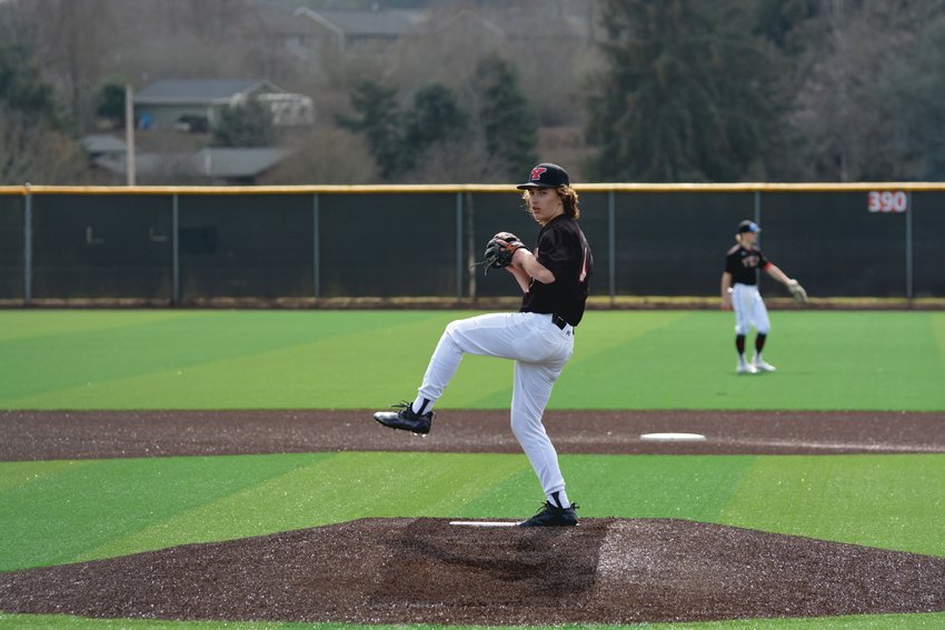 Freshman pitcher Parker Myers winds up to deliver a pitch against Rochester on Thursday, March 30.
