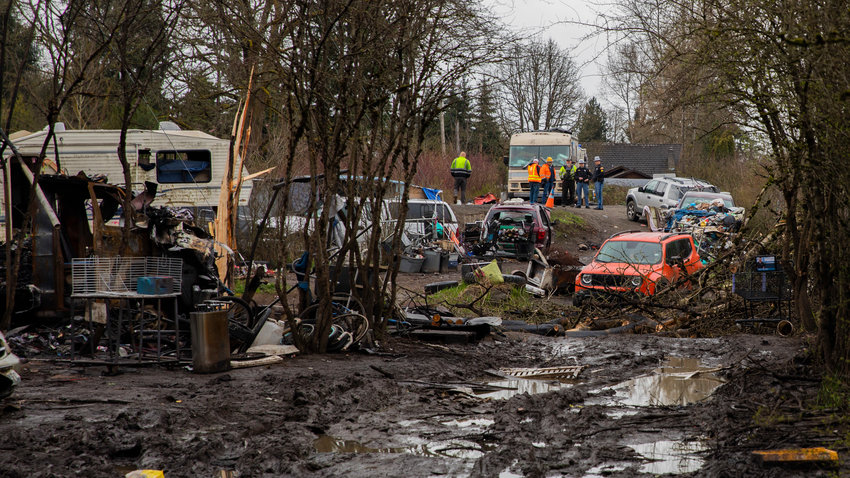 Members of the Washington State Patrol and Washington State Department of Transportation crews work to remove vehicles that are obstacles for responding emergency personnel with help from Grant&rsquo;s and JJ&rsquo;s Towing at the end of Eckerson Road in Centralia on Thursday, April 6, 2023.
