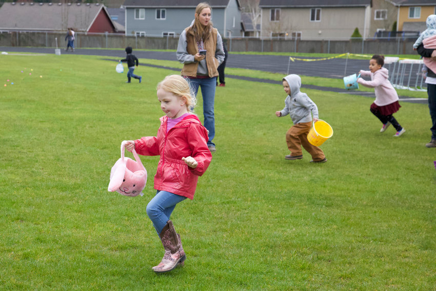 Kids race to grab Easter eggs at the Napavine High School Sports Complex on Saturday.