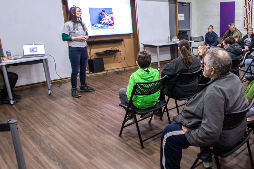 Lisa Striedinger, certifited peer specialist for the nonprofit organization Friends Without Homes, talks with attendees of a forum about the &quot;myths and facts of homelessness&quot; last April.