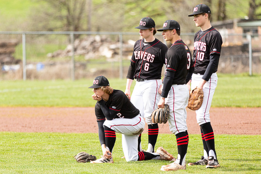 Tenino's Cody Strawn (left) looks on as he's replaced on the mound against Montesano April 13 at Beaver Ballpark.