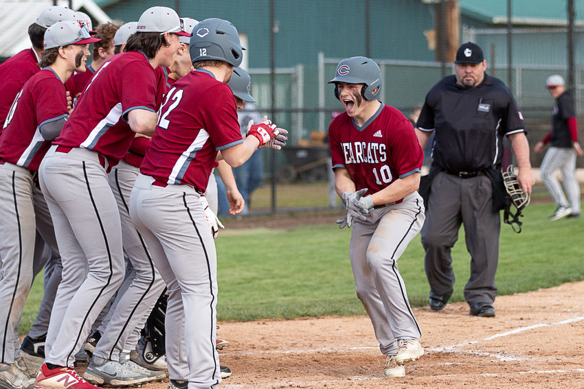 W.F. West outfielder Lane Sahlin (10) celebrates with his team at home plate after hitting a home run against Centralia at Wheeler Field April 14.