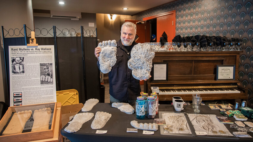 Cliff Barackman, from the show &ldquo;Finding Bigfoot,&rdquo; poses for a photo holding up Sasquatch casts at McFiler&rsquo;s Chehalis Theater during a &ldquo;Bigfoot: Real or Hoax?&rdquo; presentation on Saturday, April 15, 2023.